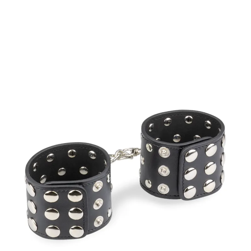 Menottes poignets cuir noir rivets