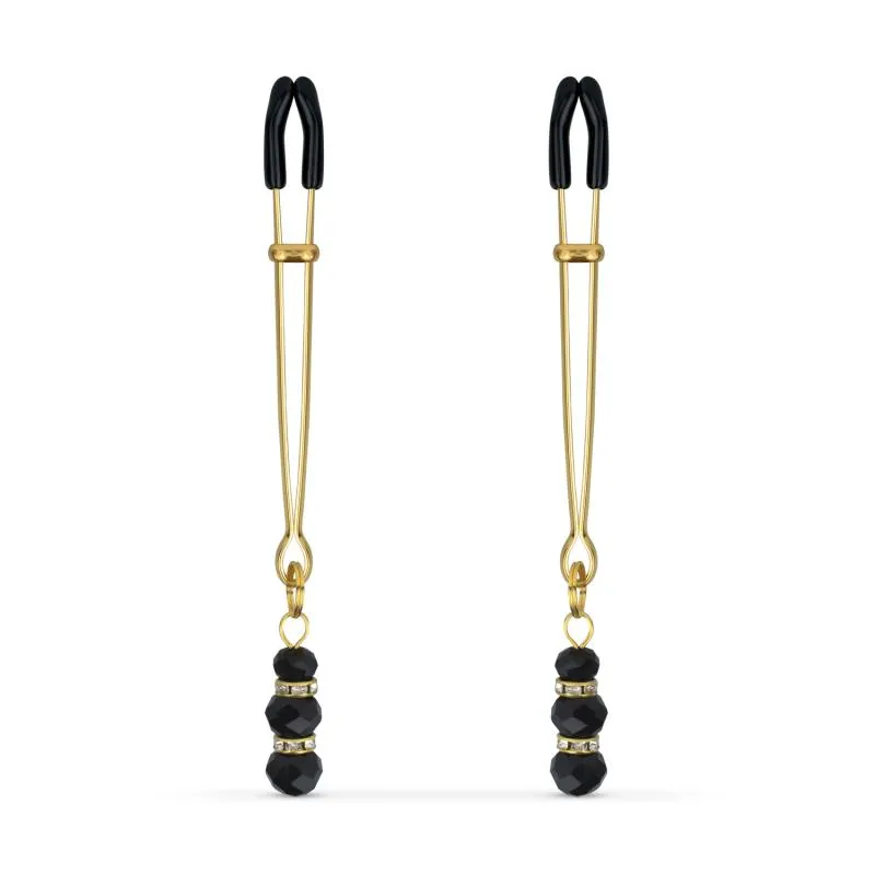 Pinces à mamelons dorées avec des perles noires